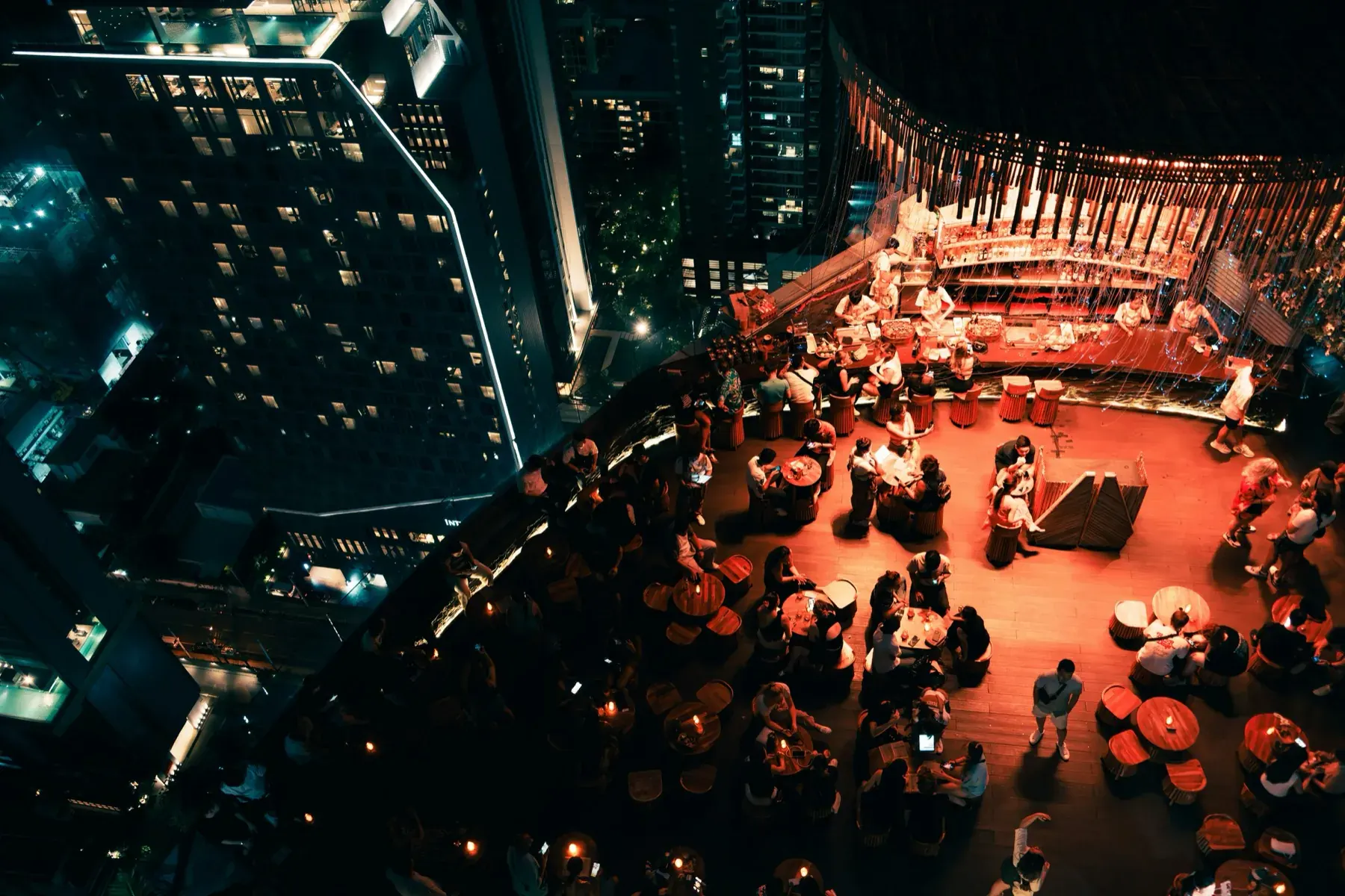 A rooftop event at dusk — refined, precise, exclusive