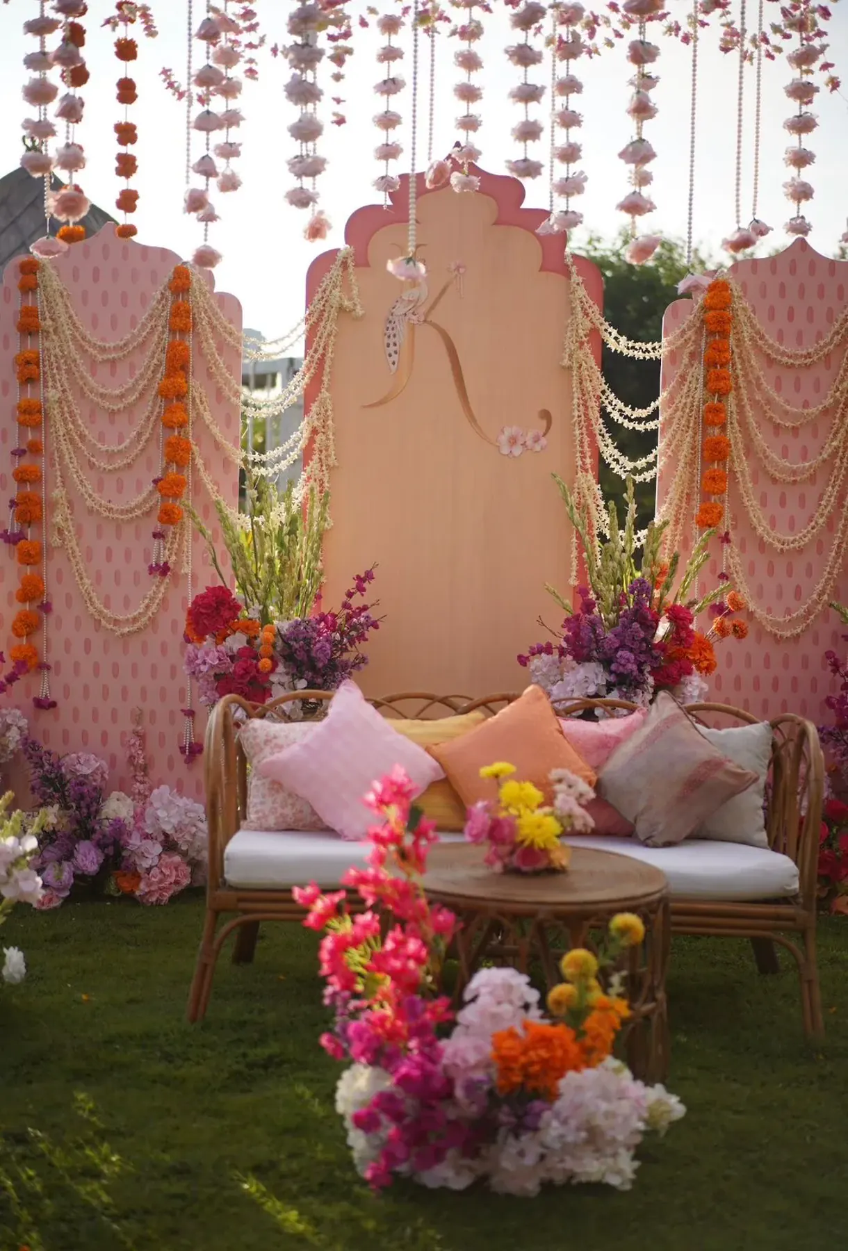 Monogrammed lounge with marigold and jasmine garlands