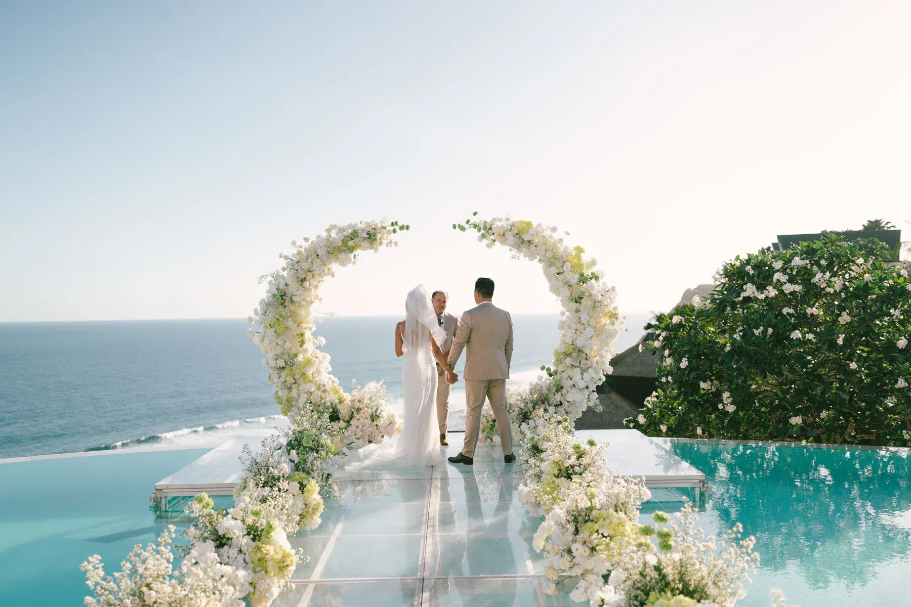 Vows exchanged on a glass platform above the ocean